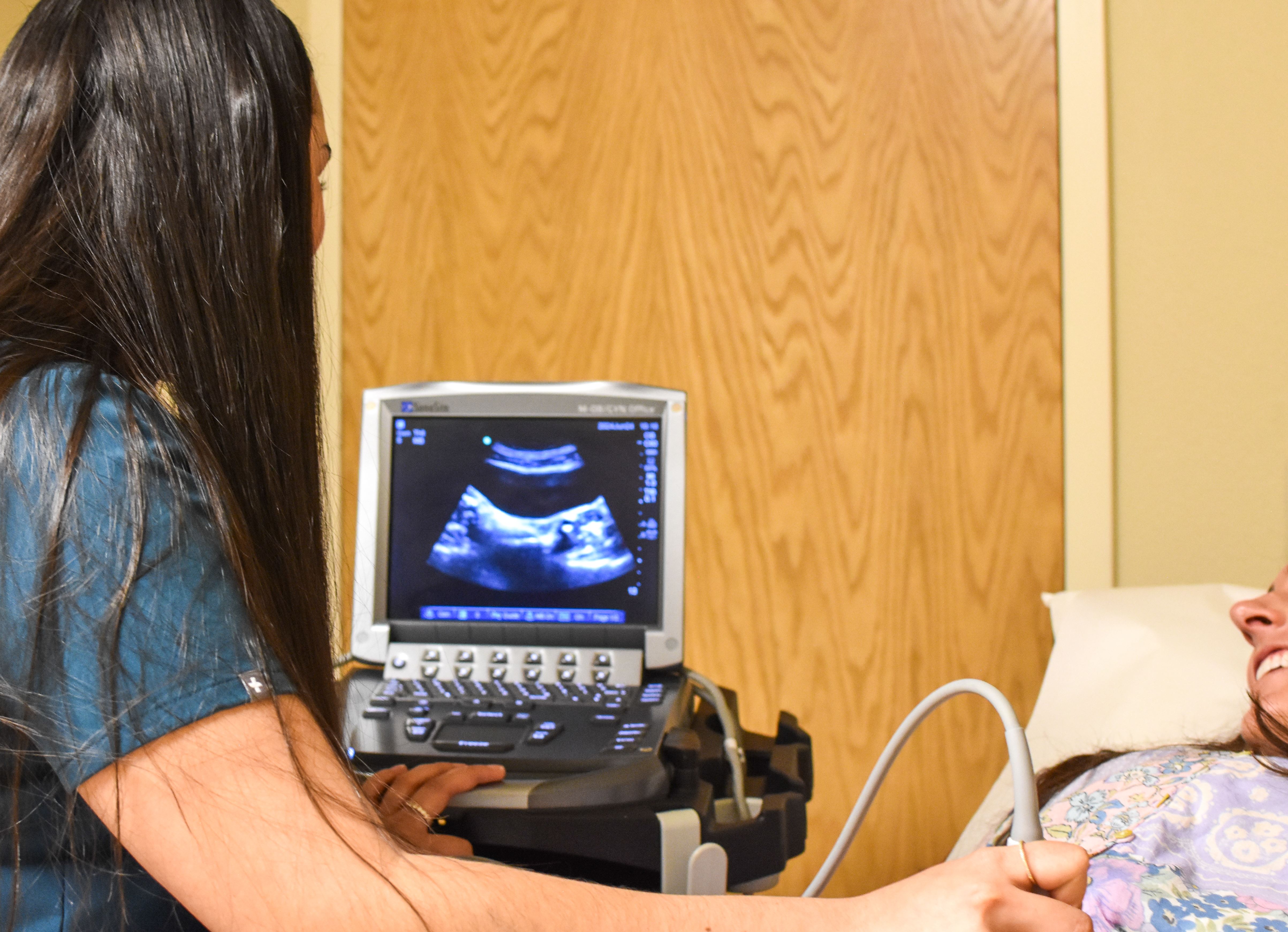 tech doing an ultrasound on patient 