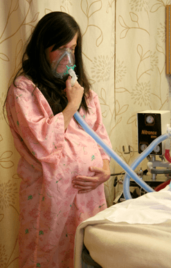women holding an oxygen mask