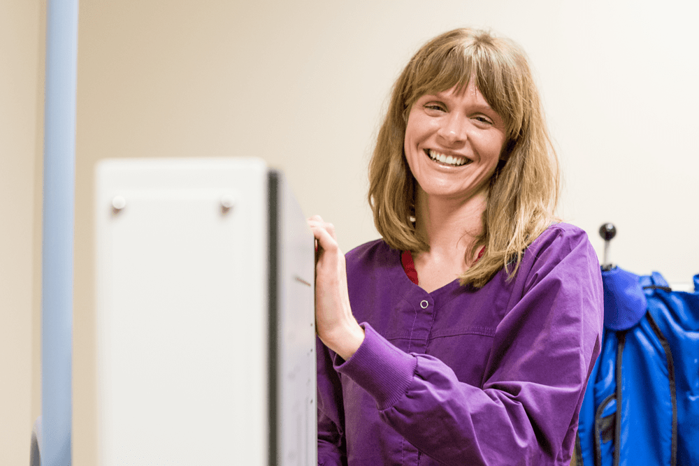 doctor in purple shirt