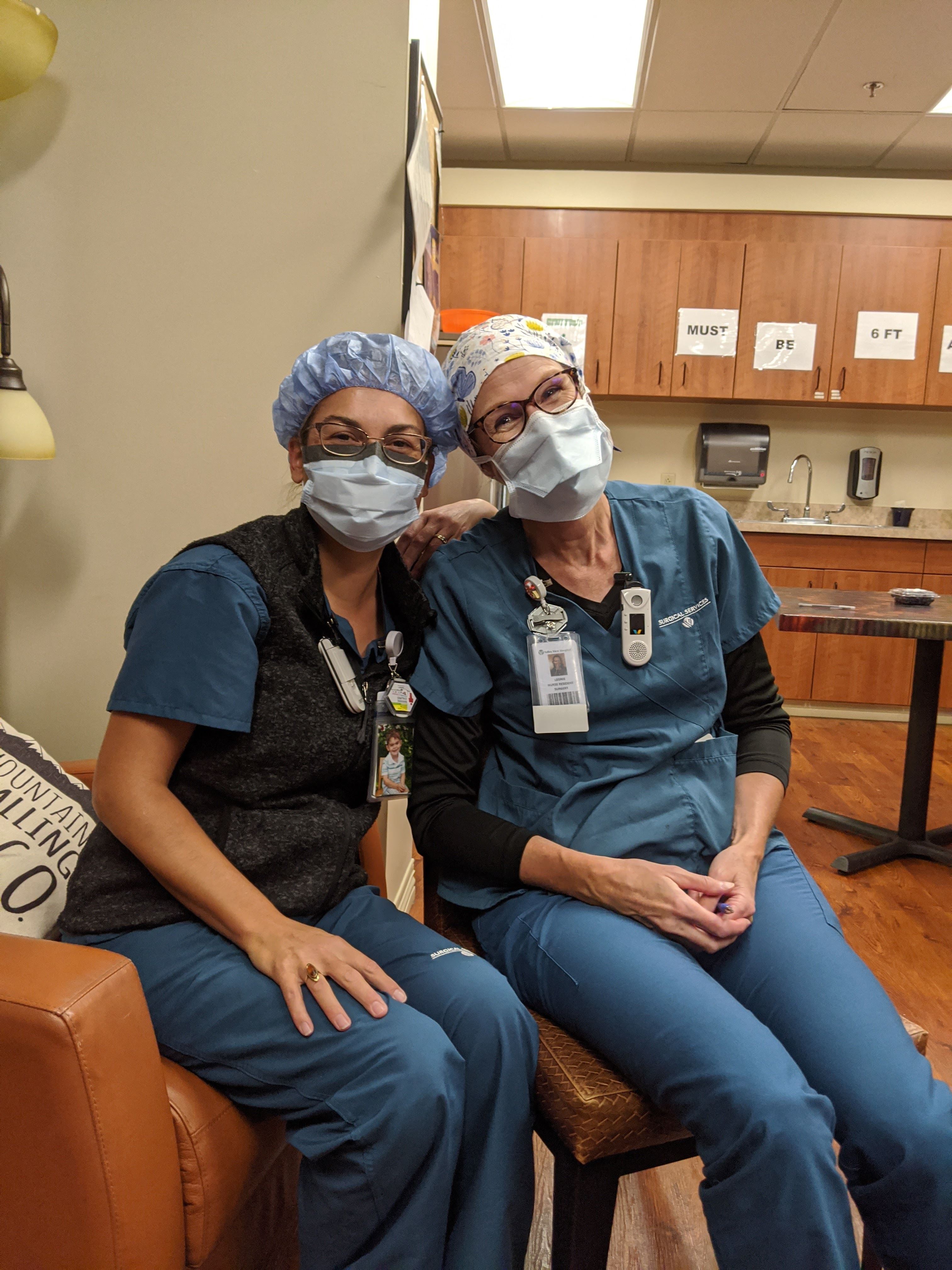 smiling providers with masks on